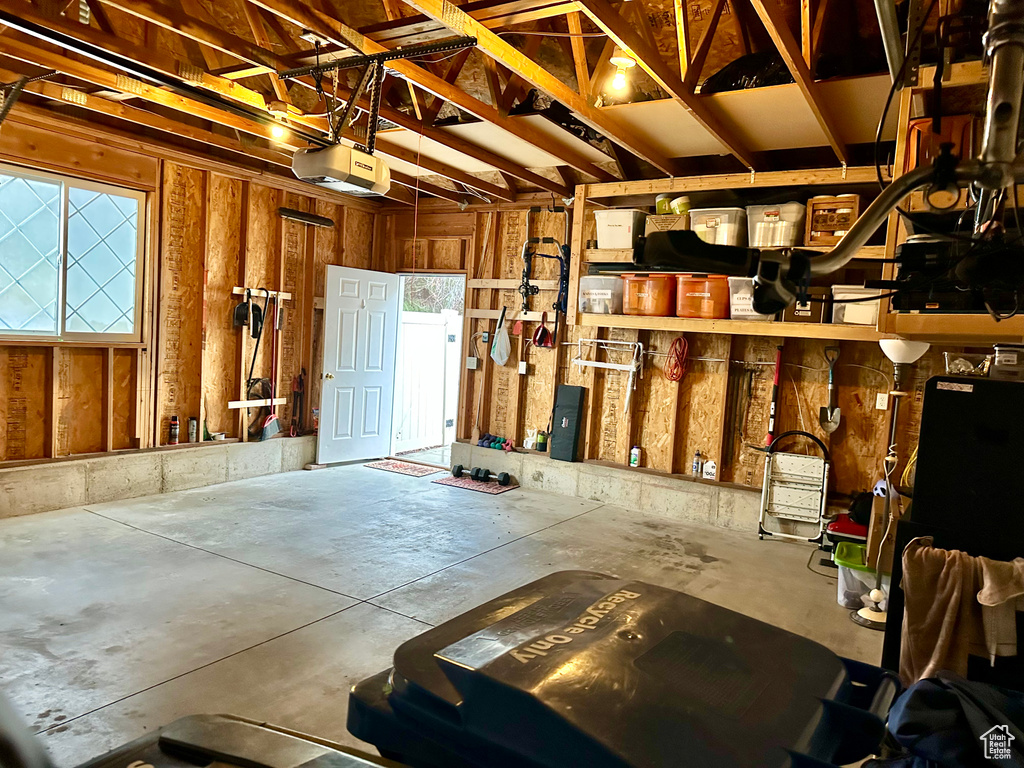 Garage featuring a garage door opener