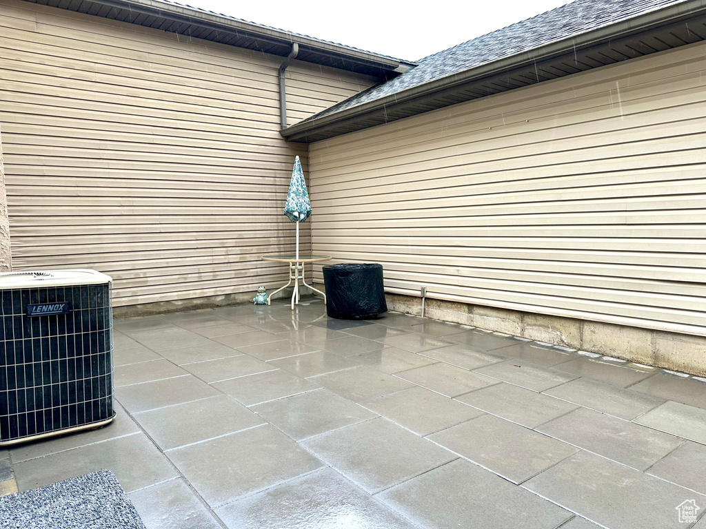 View of patio with central air condition unit