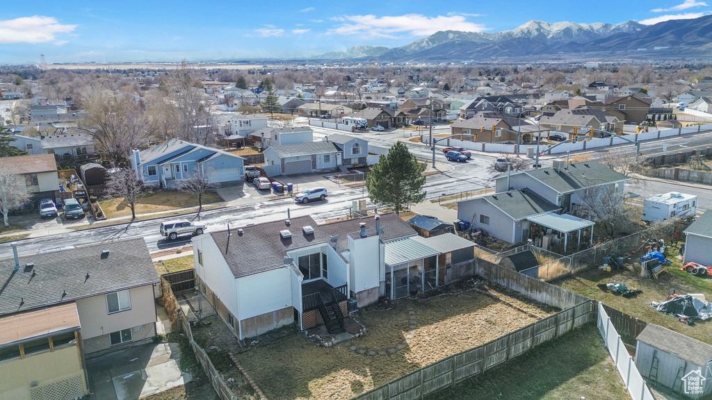 Birds eye view of property with a mountain view