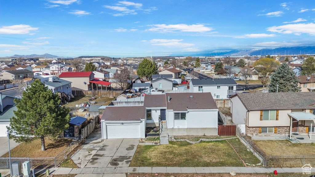 Birds eye view of property with a mountain view