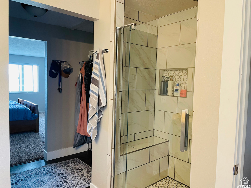 Bathroom with a shower with door