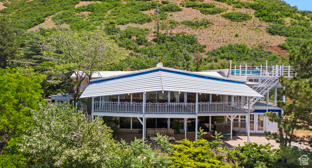Rear view of house featuring french doors and a patio