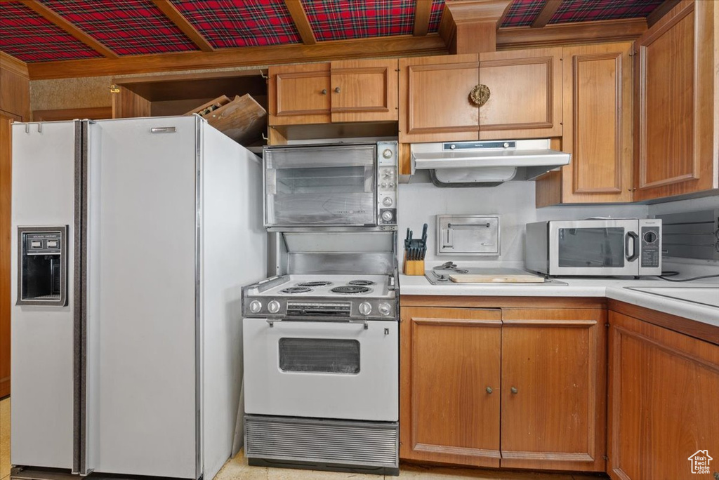 Kitchen featuring white appliances