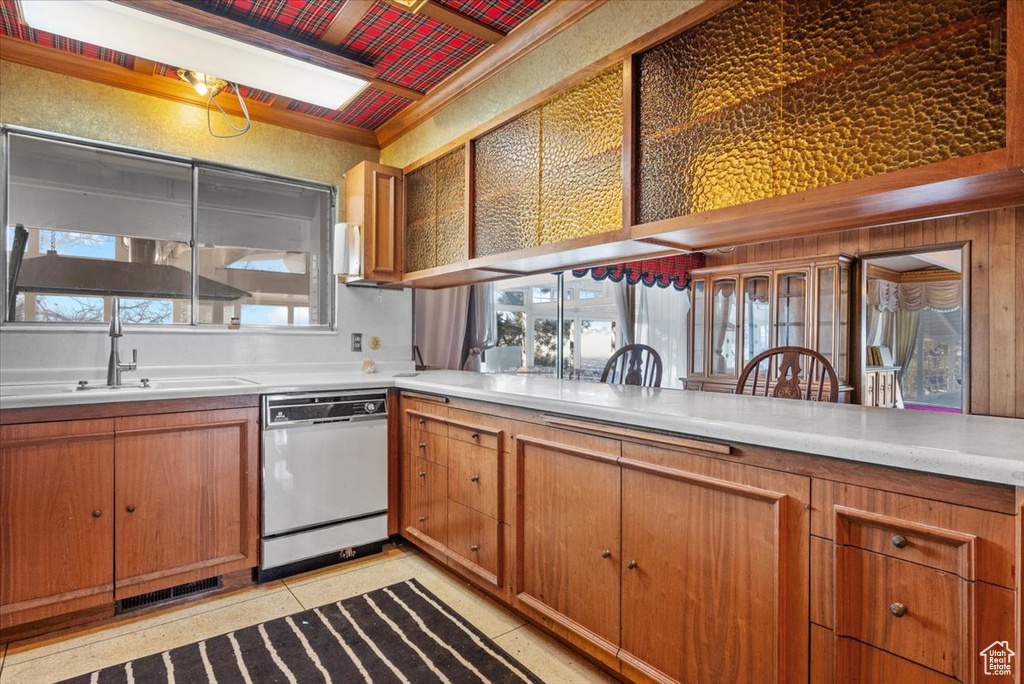 Kitchen with white dishwasher and sink