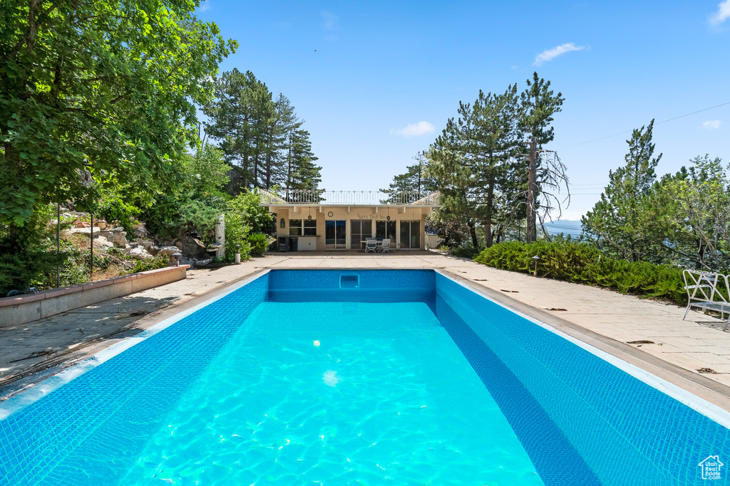 Outdoor pool with a patio