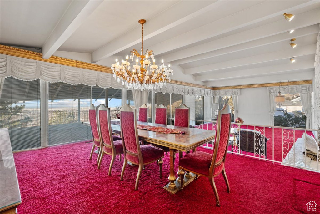 Dining space featuring a notable chandelier, beam ceiling, and carpet