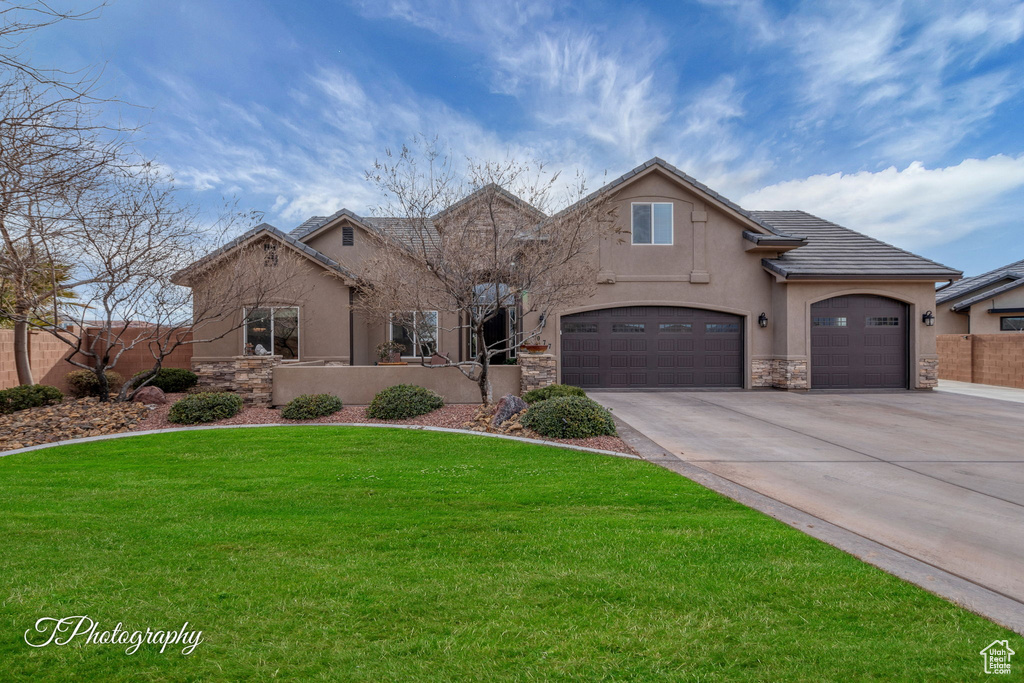 View of front of home featuring a front lawn