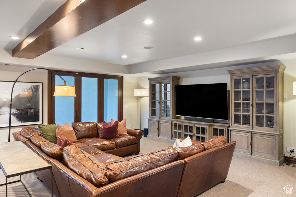 Living room featuring light colored carpet and recessed lighting
