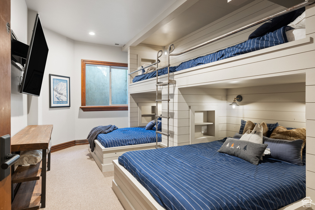 Carpeted bedroom featuring baseboards and recessed lighting