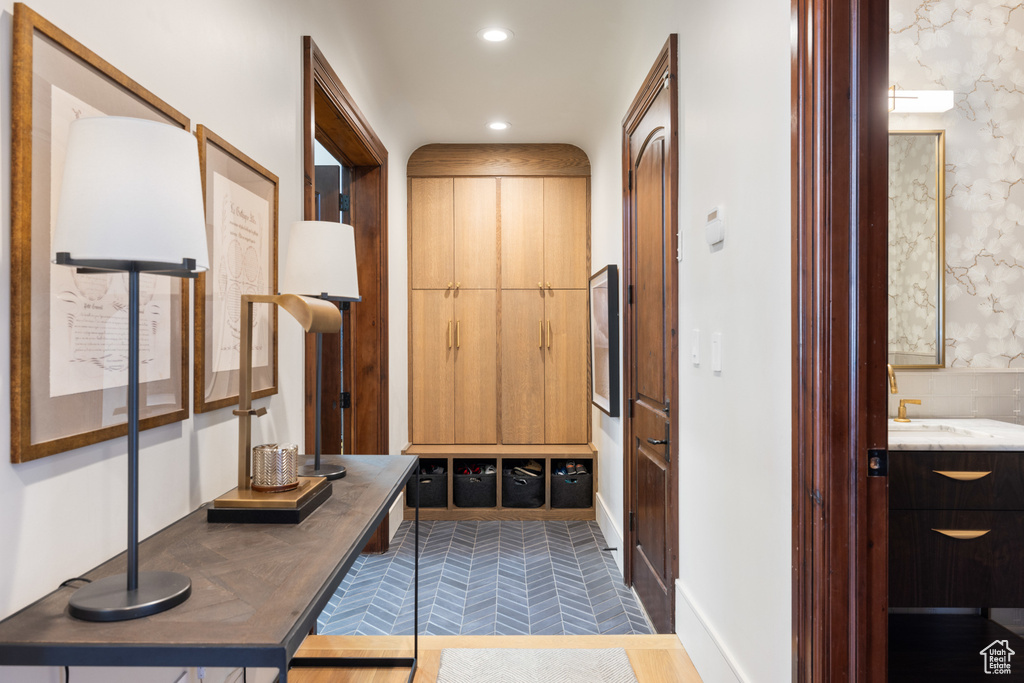 Mudroom featuring a sink and recessed lighting