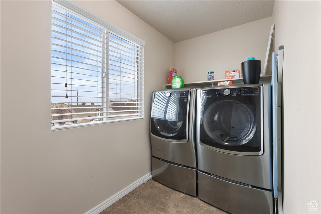 Clothes washing area featuring independent washer and dryer