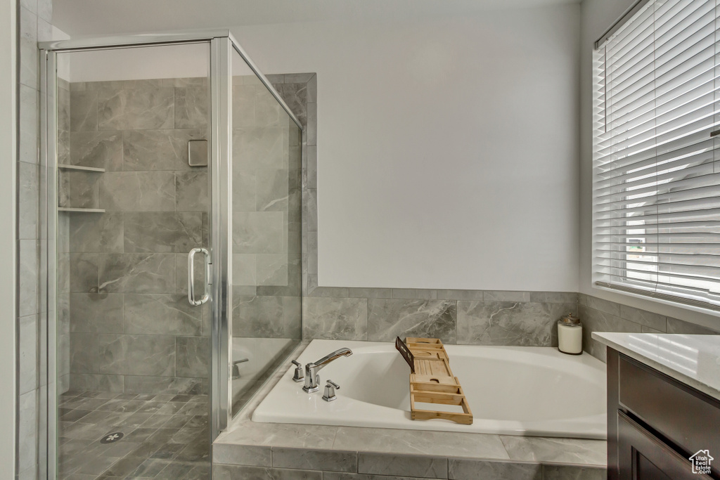 Bathroom with vanity and independent shower and bath