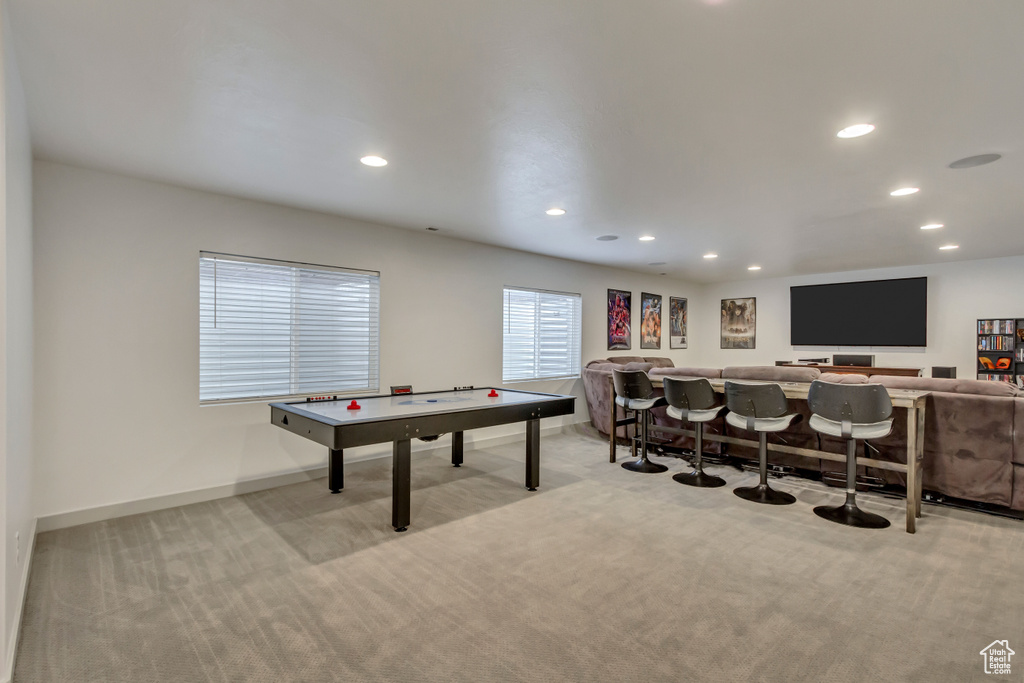 Playroom featuring indoor bar and light carpet