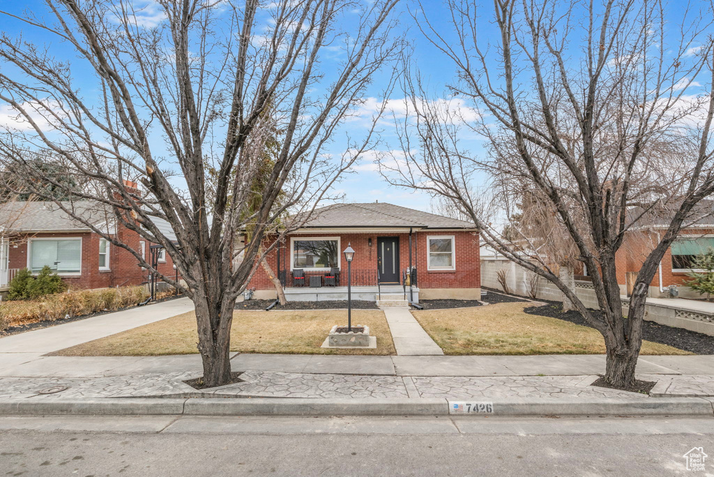 View of front of property with a front lawn