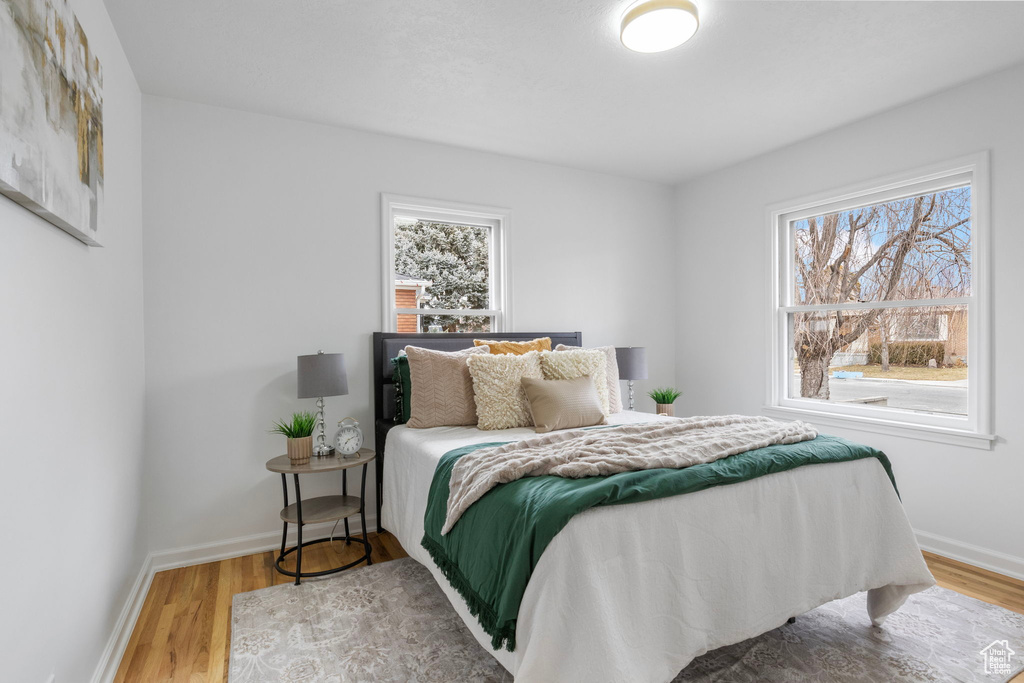 Bedroom with wood-type flooring