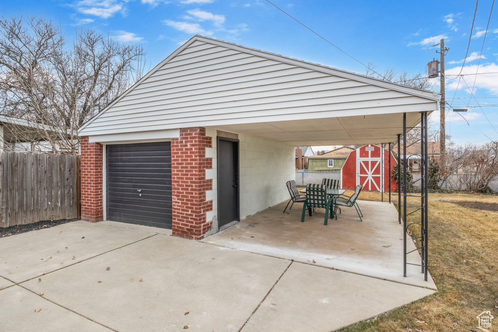 Garage featuring a carport