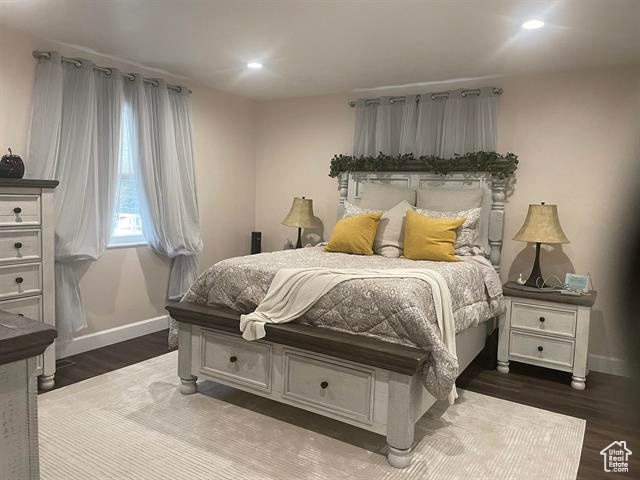 Bedroom featuring dark hardwood / wood-style flooring