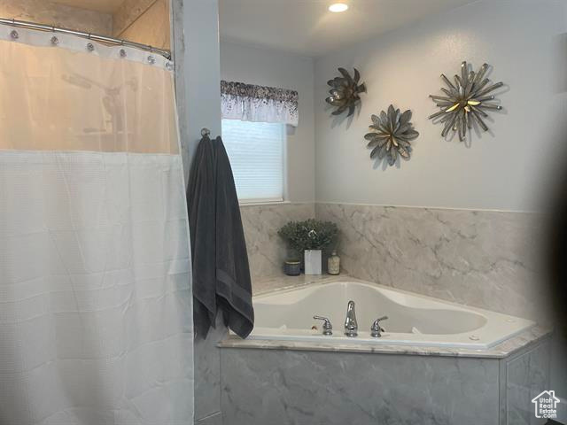 Bathroom featuring separate shower and tub