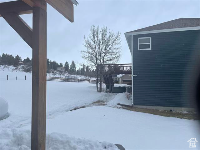 View of yard layered in snow