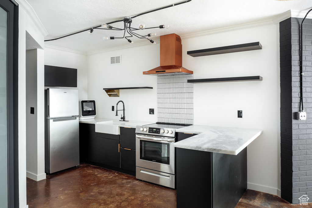 Kitchen featuring island exhaust hood, open shelves, crown molding, dark cabinetry, and appliances with stainless steel finishes