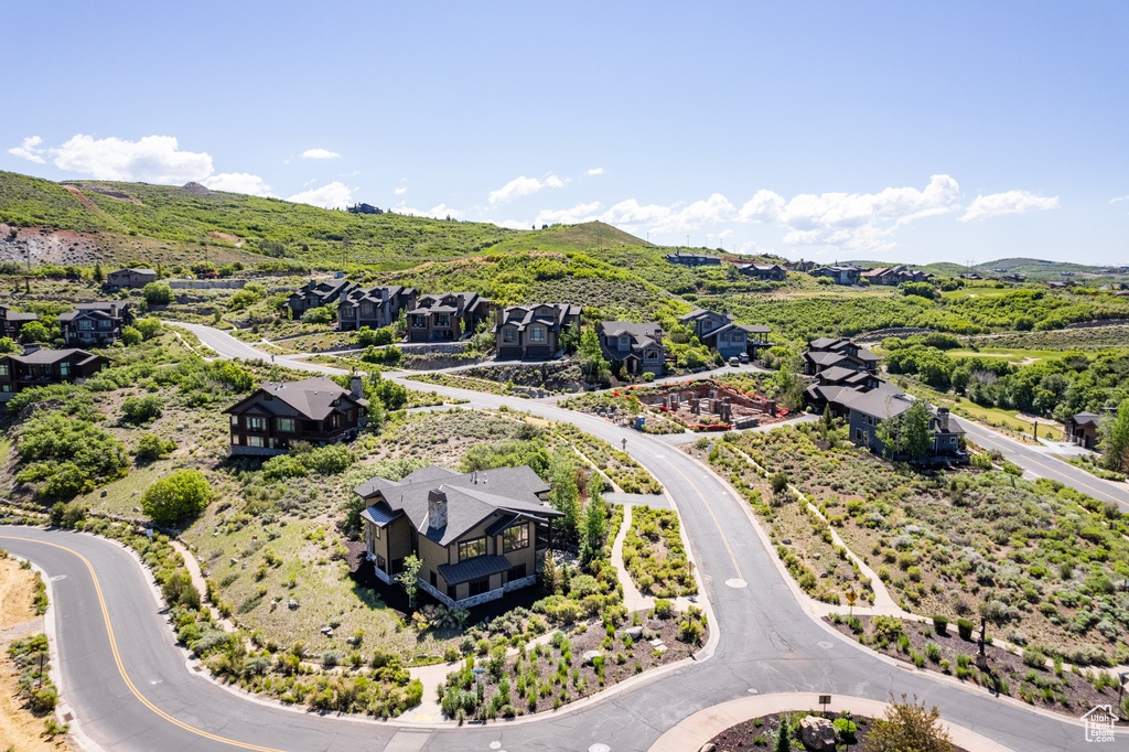 Aerial perspective of suburban area with a mountainous background