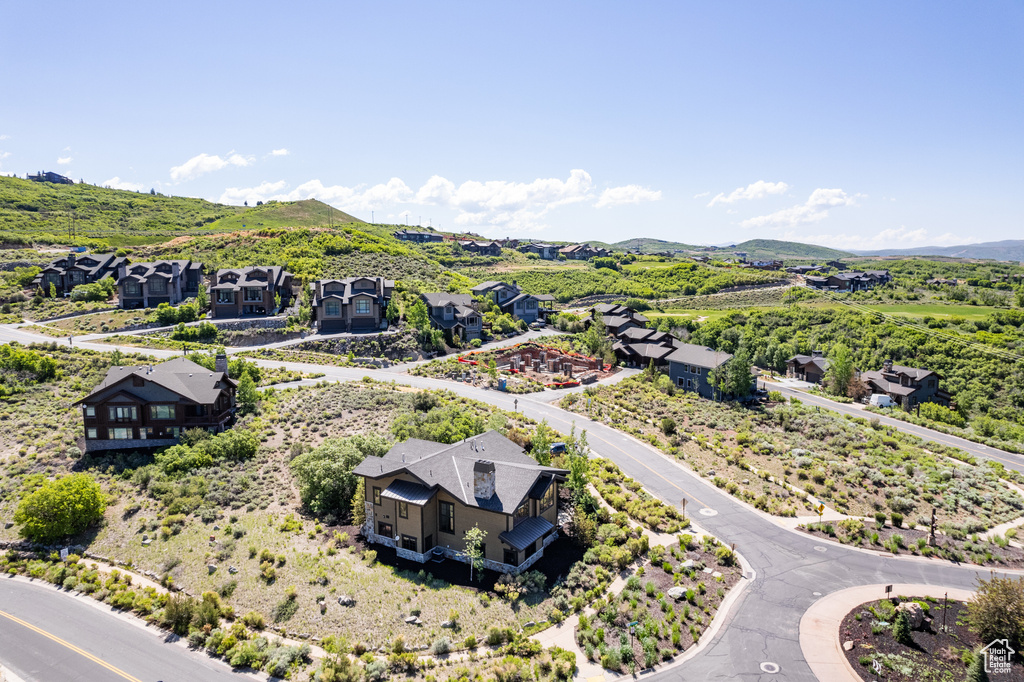 Aerial perspective of suburban area featuring a mountain backdrop