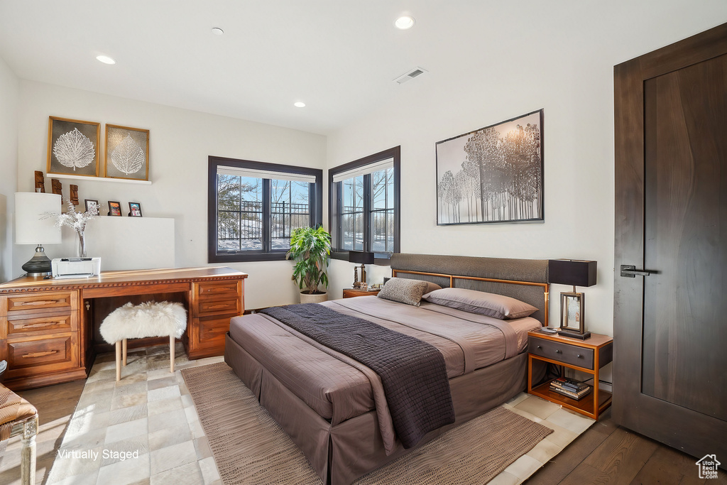 Bedroom with a desk and recessed lighting