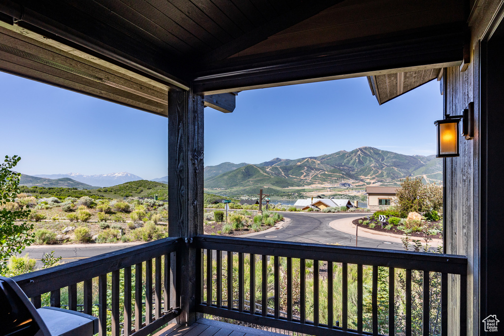 Wooden terrace featuring a mountain view
