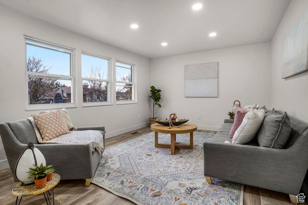 Living room with light hardwood / wood-style floors