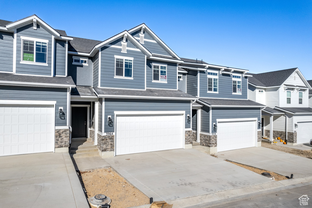 View of front facade featuring a garage