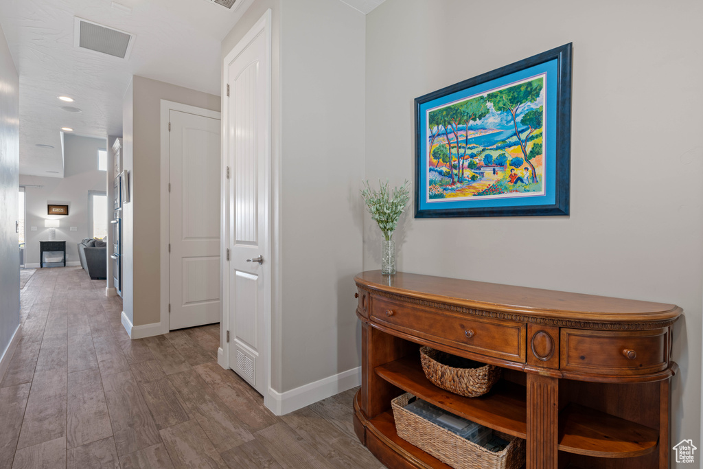 Hallway featuring light hardwood / wood-style flooring