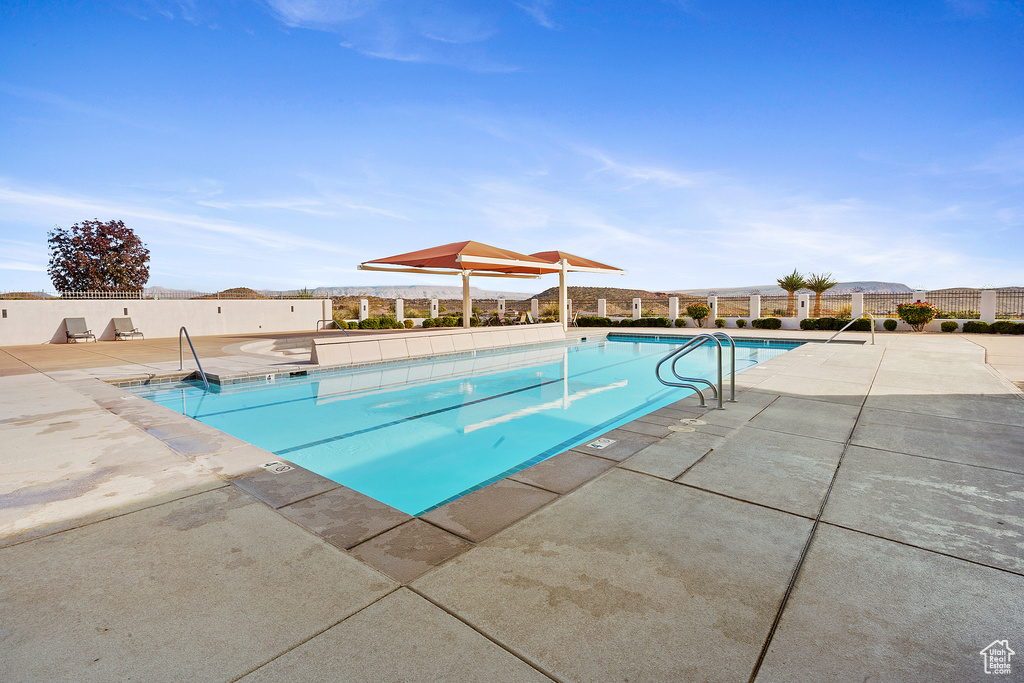 View of pool with a gazebo and a patio