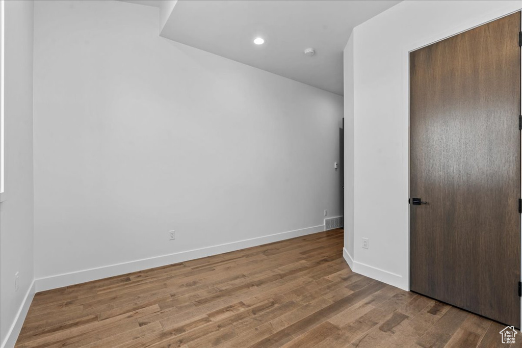 Unfurnished room featuring hardwood / wood-style flooring