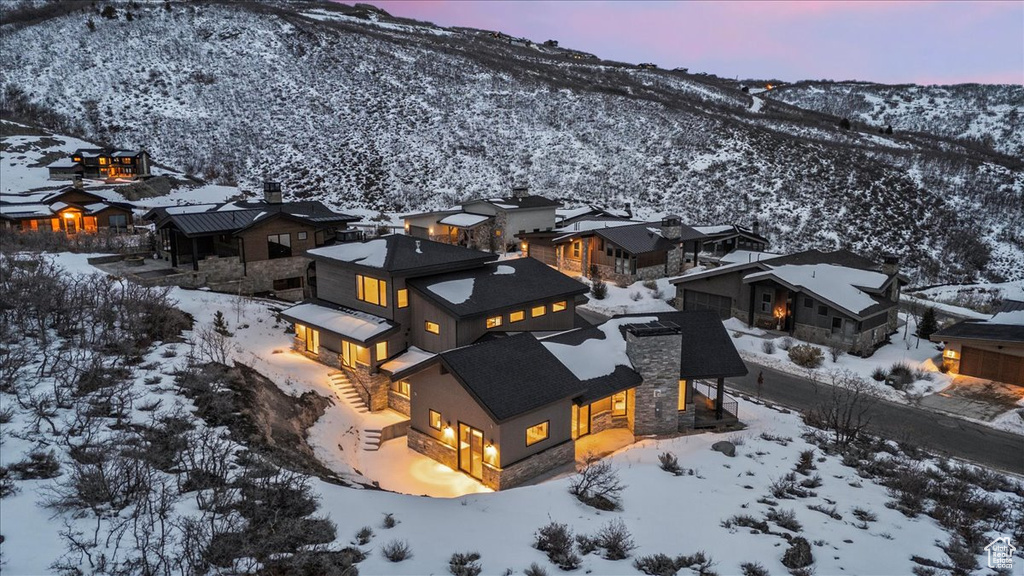 Snowy aerial view featuring a mountain view