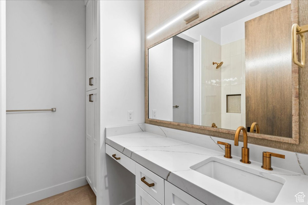 Bathroom with vanity and walk in shower