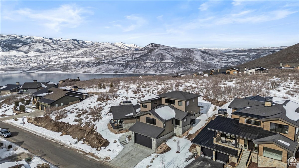 Snowy aerial view featuring a mountain view