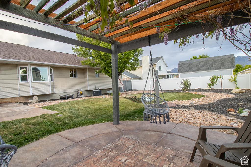 View of patio featuring a pergola and cooling unit