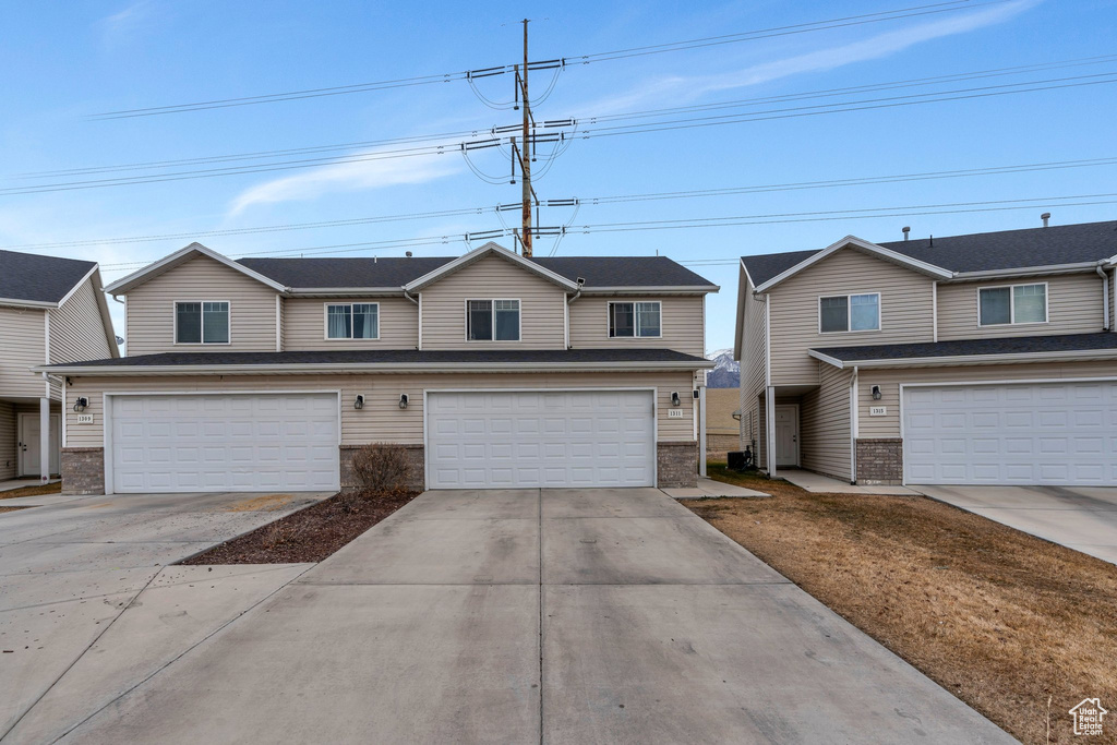View of front facade featuring a garage