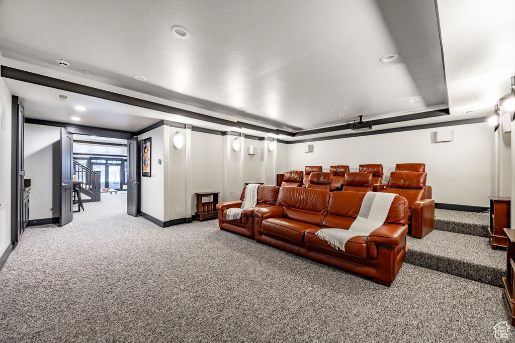Carpeted home theater with baseboards and recessed lighting
