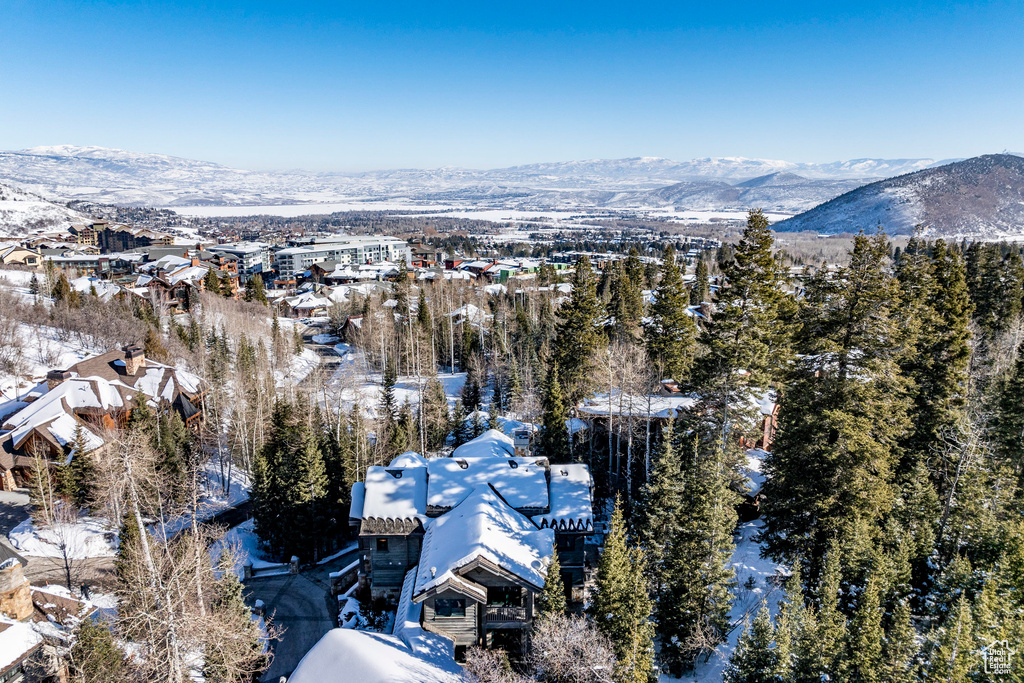 Snowy aerial view featuring a mountain view