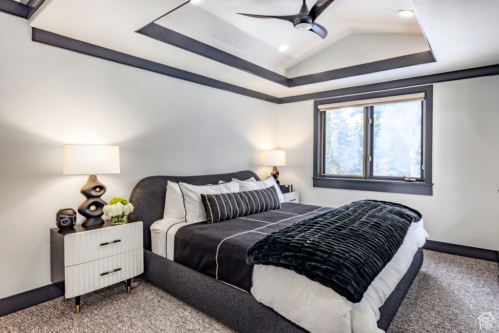 Bedroom with carpet floors, ceiling fan, baseboards, recessed lighting, and a raised ceiling