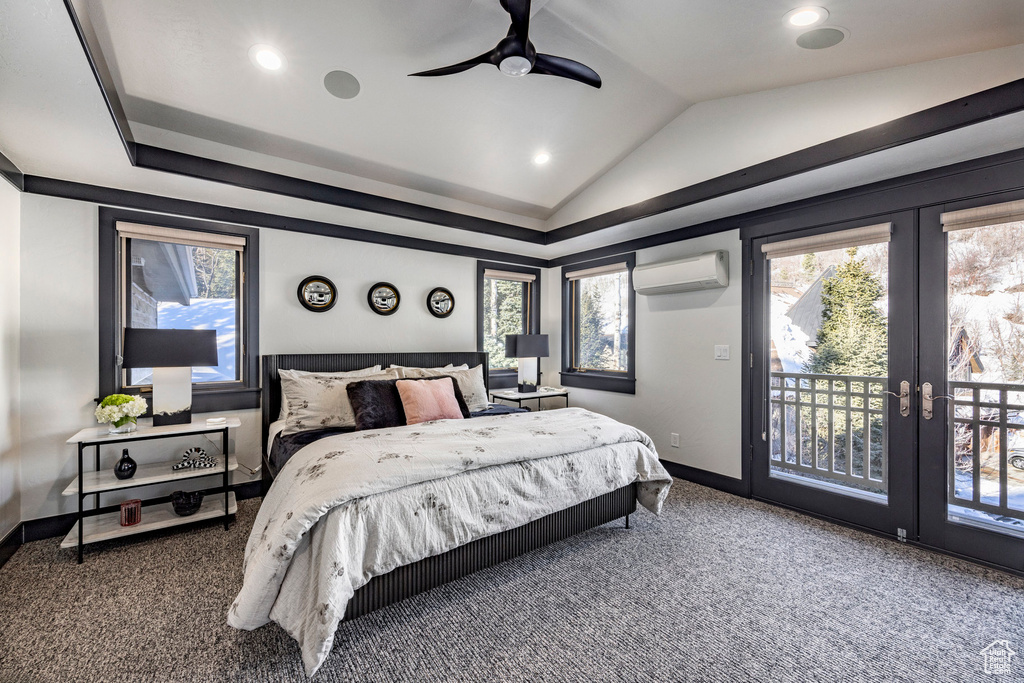 Carpeted bedroom with an AC wall unit, access to outside, lofted ceiling, baseboards, and multiple windows