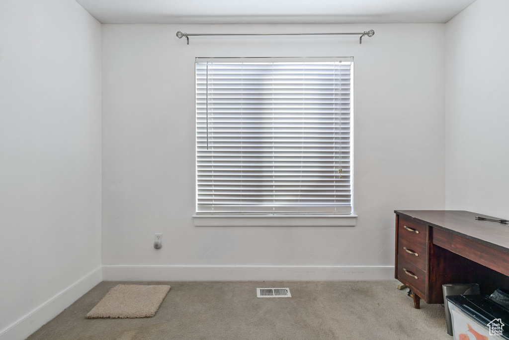 Office area with light colored carpet