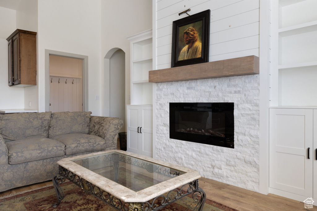 Living room featuring light hardwood / wood-style flooring and built in features