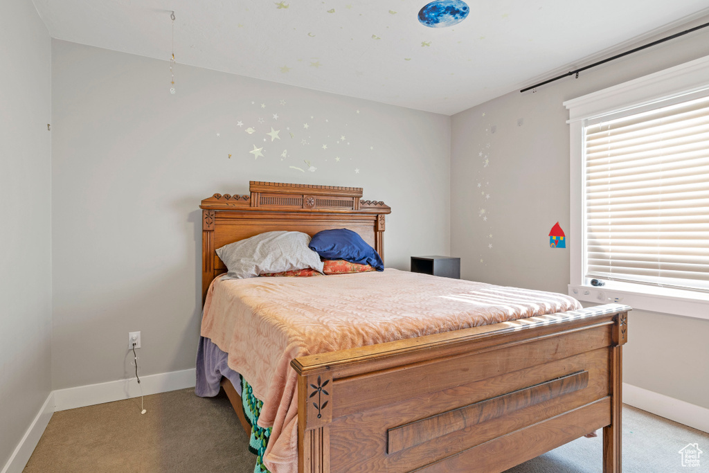 Bedroom with light carpet