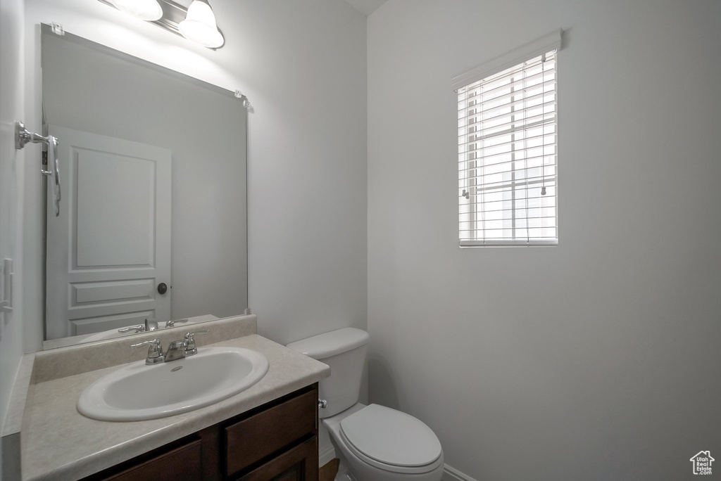 Bathroom with toilet and vanity