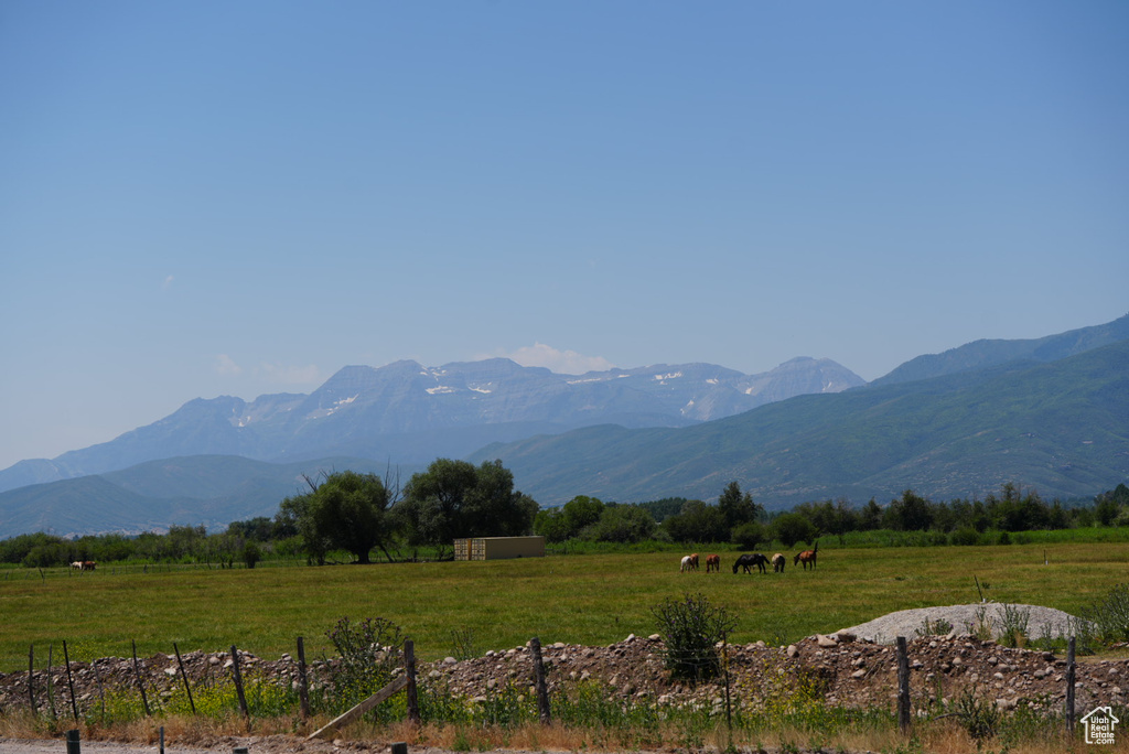 Property view of mountains with a rural view