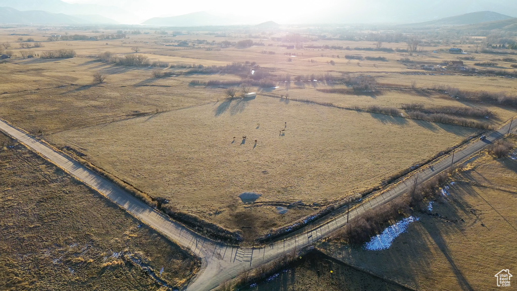 Aerial view featuring a rural view and a mountain view
