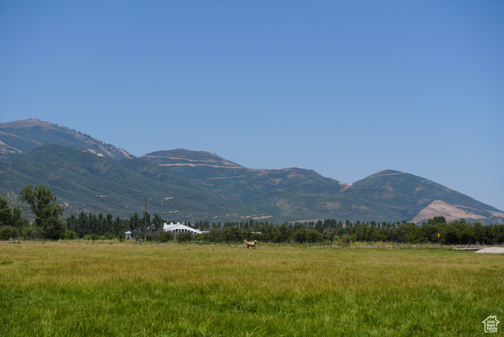 Property view of mountains featuring a rural view