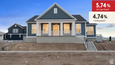 Rear view of property featuring a porch and stairway